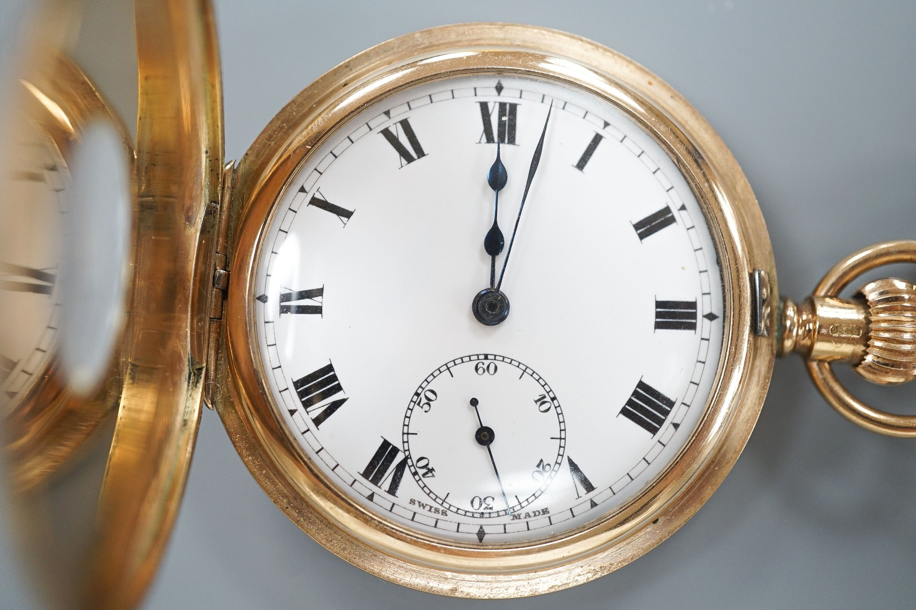 A George V 9ct gold half hunter pocket watch, 46mm, gross 74.9 grams, together with a 9ct gold cub link albert, 42cm, 21.2 grams.